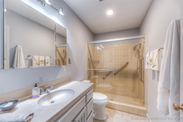 full bath featuring a stall shower, vanity, and toilet