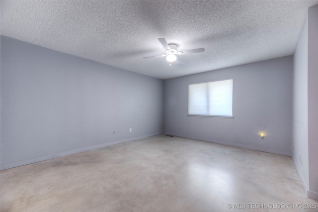 spare room featuring a textured ceiling, baseboards, and a ceiling fan