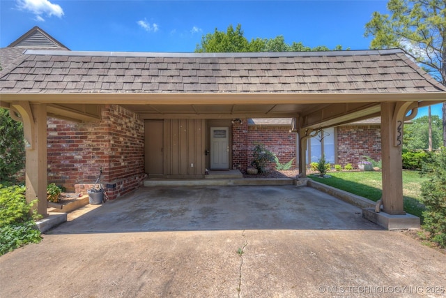 view of car parking with driveway and a carport