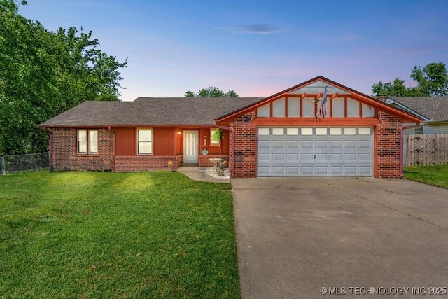 ranch-style home featuring fence, an attached garage, brick siding, a yard, and concrete driveway