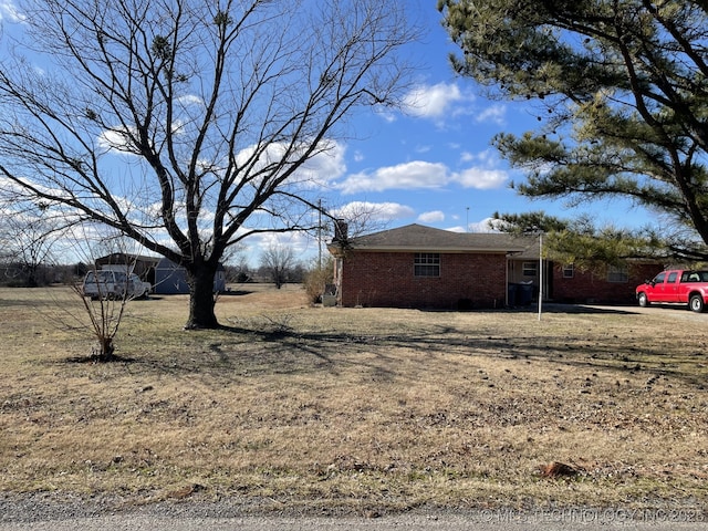 view of property exterior featuring brick siding