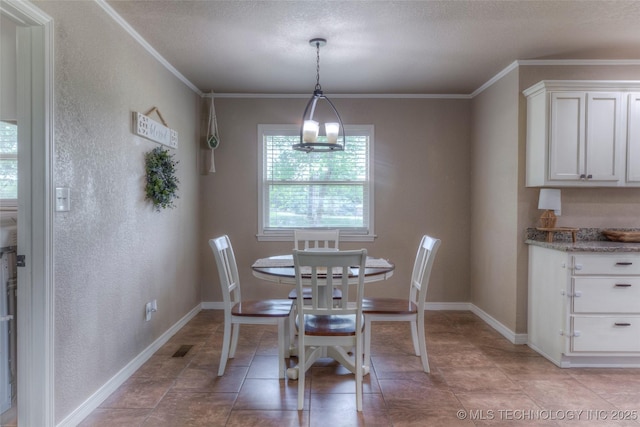 dining space with crown molding, a textured ceiling, and baseboards