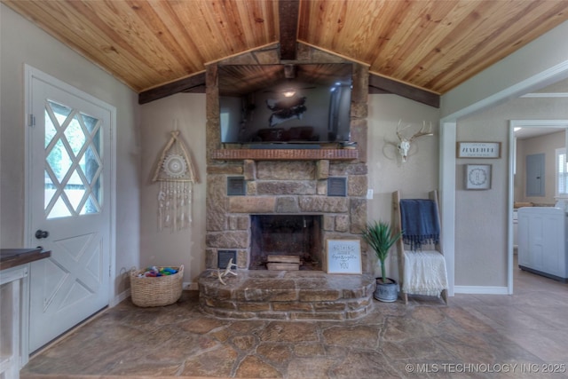 living area featuring wood ceiling, stone finish flooring, vaulted ceiling with beams, baseboards, and a stone fireplace