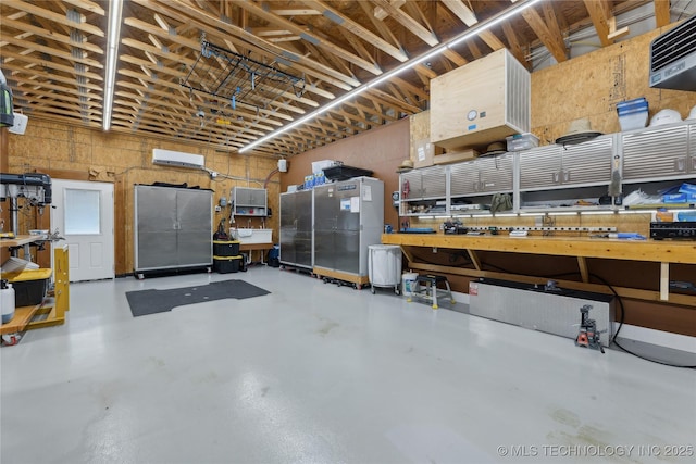 16550 S Elwood Ave, Glenpool, OK 74033 - garage featuring a wall mounted AC and a workshop area