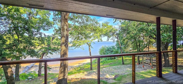 wooden terrace featuring visible vents