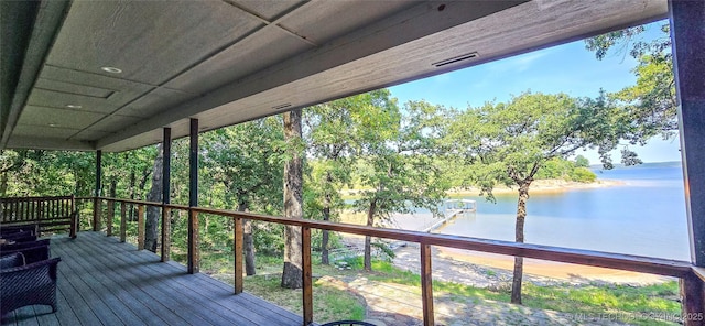 deck with a water view and visible vents