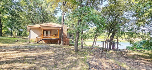exterior space featuring a water view and french doors