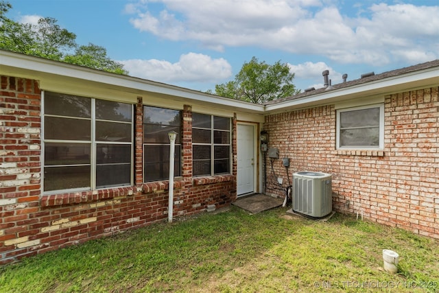1117 W Chambers Ct, Claremore, OK 74017 - exterior space with a yard, central AC unit, and brick siding