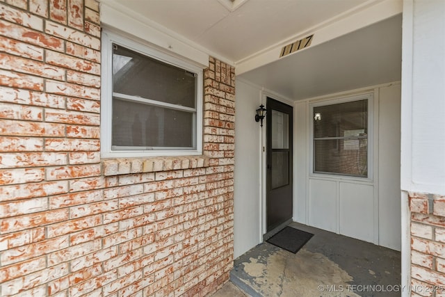 1117 W Chambers Ct, Claremore, OK 74017 - doorway to property with brick siding and visible vents