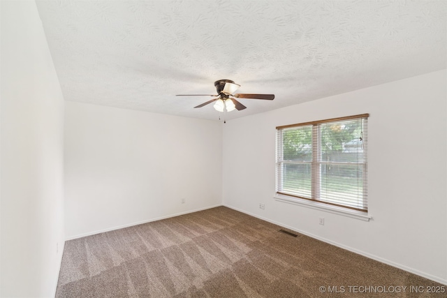 1117 W Chambers Ct, Claremore, OK 74017 - carpeted spare room with a textured ceiling, visible vents, baseboards, and a ceiling fan