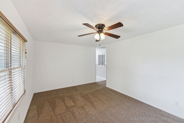 1117 W Chambers Ct, Claremore, OK 74017 - carpeted empty room with a textured ceiling, baseboards, and a ceiling fan