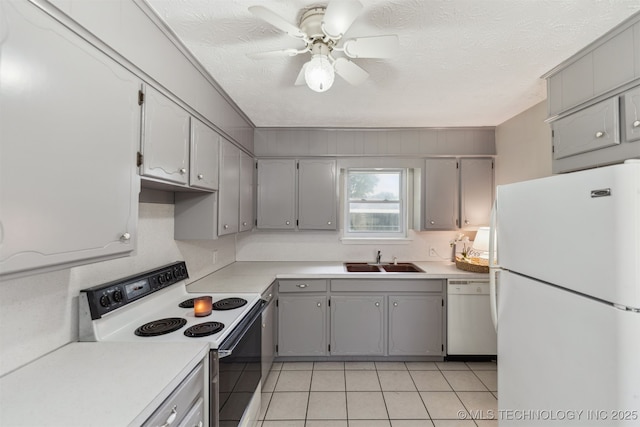 1117 W Chambers Ct, Claremore, OK 74017 - kitchen featuring a ceiling fan, light tile patterned floors, white appliances, a sink, and gray cabinets