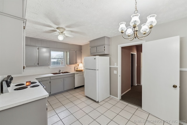 1117 W Chambers Ct, Claremore, OK 74017 - kitchen featuring white appliances, light countertops, a sink, and gray cabinets