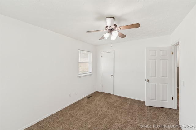 1117 W Chambers Ct, Claremore, OK 74017 - unfurnished bedroom featuring carpet flooring, visible vents, baseboards, and ceiling fan