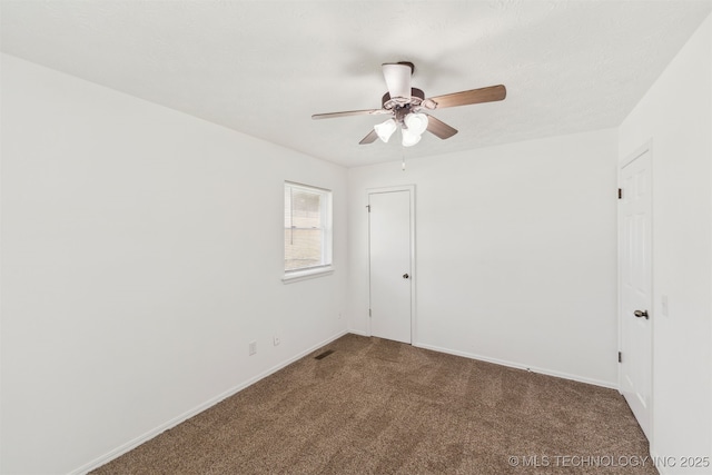 1117 W Chambers Ct, Claremore, OK 74017 - carpeted spare room featuring visible vents, baseboards, and a ceiling fan