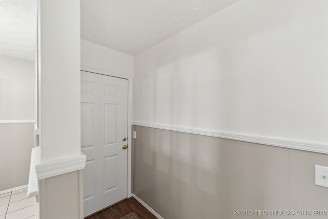 1117 W Chambers Ct, Claremore, OK 74017 - doorway to outside featuring a textured ceiling