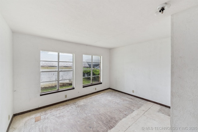 1117 W Chambers Ct, Claremore, OK 74017 - spare room featuring baseboards