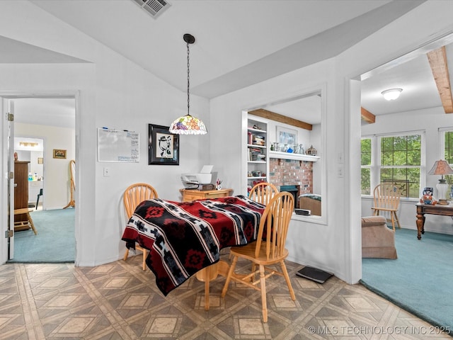 carpeted dining space with baseboards, a fireplace, visible vents, and vaulted ceiling
