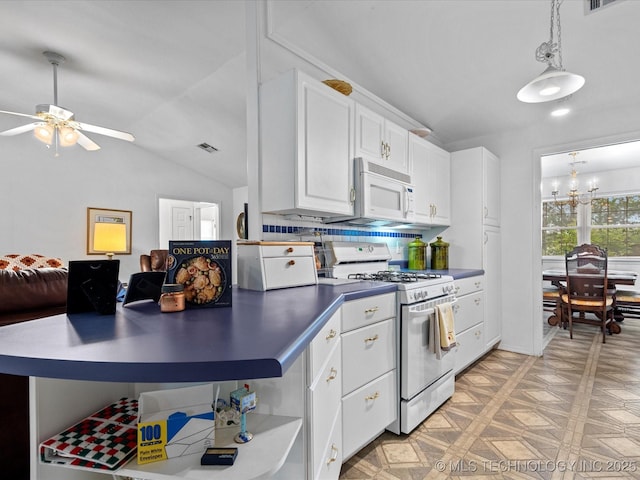 kitchen with white appliances, open shelves, vaulted ceiling, white cabinets, and dark countertops