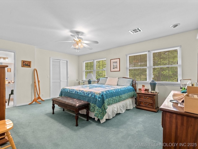 bedroom with a closet, baseboards, ceiling fan, visible vents, and carpet floors