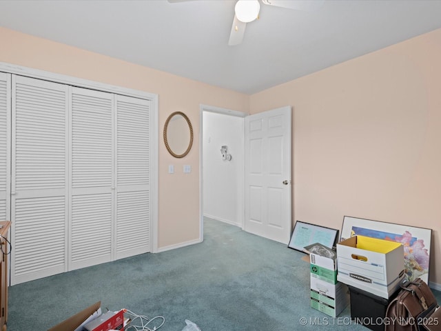 unfurnished office with carpet, baseboards, and a ceiling fan