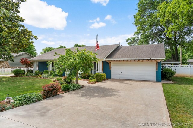 1022 W E St, Jenks, OK 74037 - view of front of home with a garage, driveway, and a shingled roof