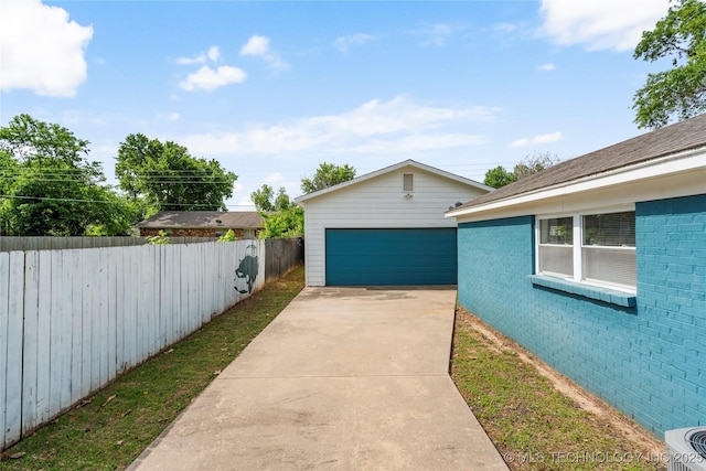 1022 W E St, Jenks, OK 74037 - view of yard featuring fence, a garage, an outbuilding, and central air condition unit