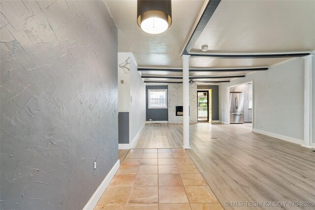 1022 W E St, Jenks, OK 74037 - foyer featuring decorative columns, baseboards, a fireplace, and a textured wall