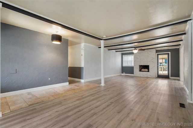 1022 W E St, Jenks, OK 74037 - unfurnished living room with wood finished floors, baseboards, and a premium fireplace