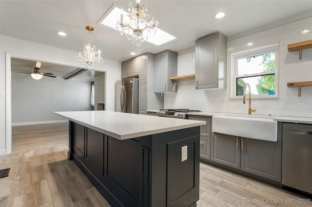 1022 W E St, Jenks, OK 74037 - kitchen featuring stainless steel appliances, open shelves, gray cabinetry, a sink, and recessed lighting