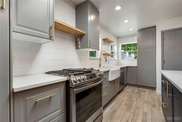 1022 W E St, Jenks, OK 74037 - kitchen with appliances with stainless steel finishes, gray cabinets, light wood finished floors, recessed lighting, and a sink