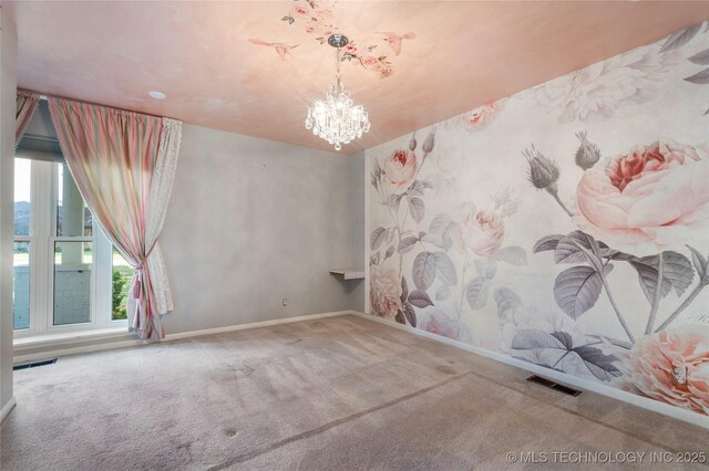 1022 W E St, Jenks, OK 74037 - empty room featuring carpet floors, baseboards, and a chandelier
