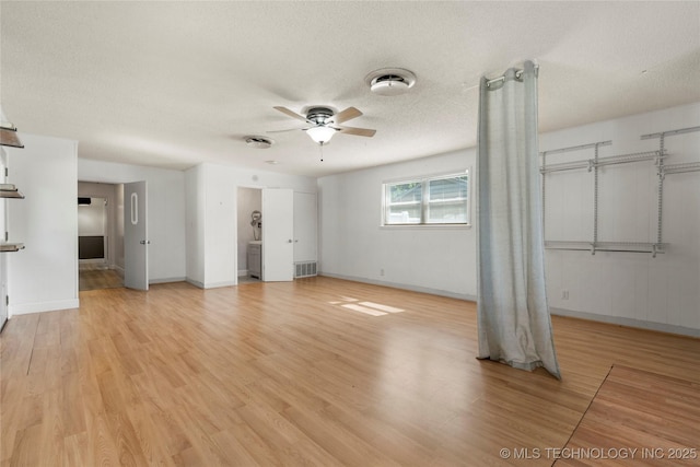 1022 W E St, Jenks, OK 74037 - unfurnished bedroom with a textured ceiling, light wood finished floors, and baseboards