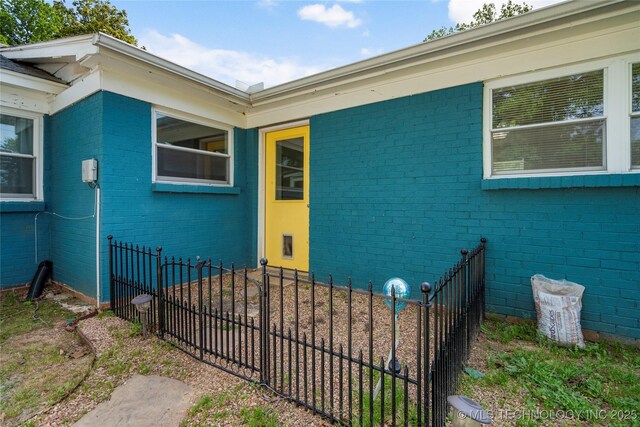 1022 W E St, Jenks, OK 74037 - property entrance with brick siding and fence
