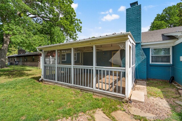 1022 W E St, Jenks, OK 74037 - rear view of house with a sunroom and a chimney