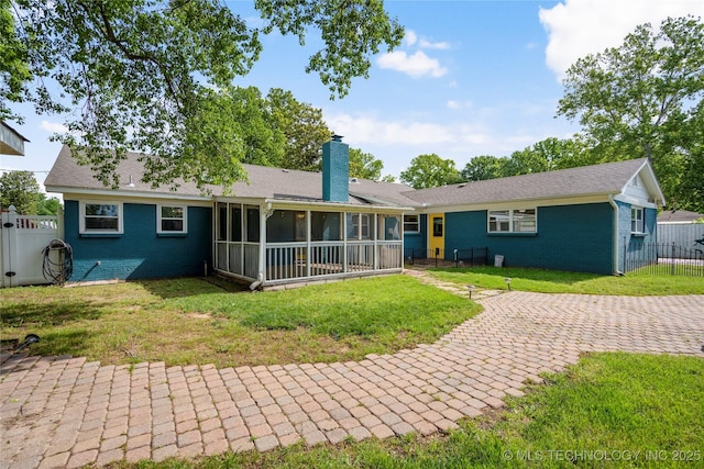 1022 W E St, Jenks, OK 74037 - rear view of house featuring a sunroom, a chimney, brick siding, and a patio