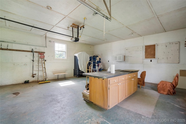 1022 W E St, Jenks, OK 74037 - garage featuring a garage door opener