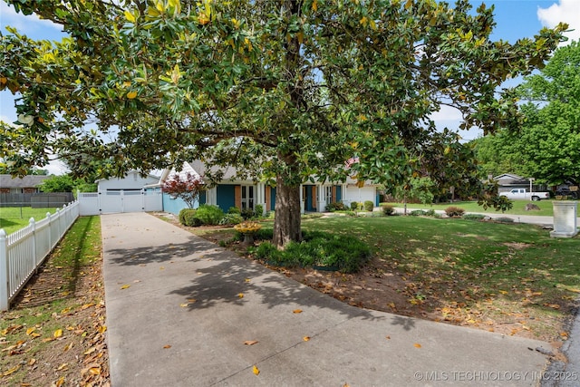1022 W E St, Jenks, OK 74037 - obstructed view of property featuring concrete driveway