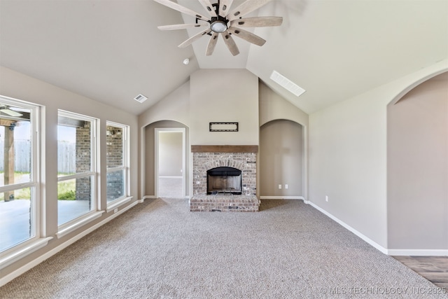 5113 S Walnut Creek Dr, Sand Springs, OK 74063 - unfurnished living room with ceiling fan, a fireplace, lofted ceiling, carpet floors, and baseboards