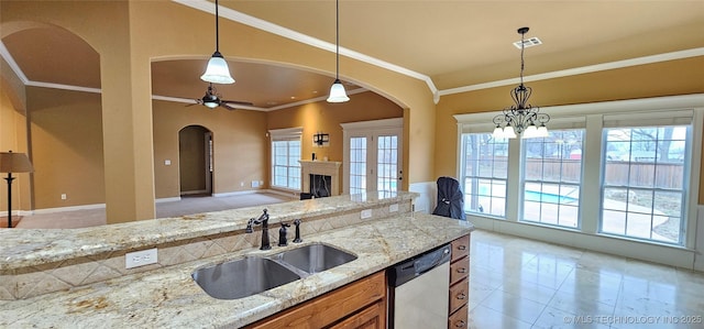 2501 Forest Ridge Parkway, Claremore, OK 74017 - kitchen featuring dishwasher, a sink, arched walkways, crown molding, and plenty of natural light