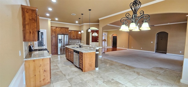 2501 Forest Ridge Parkway, Claremore, OK 74017 - kitchen with arched walkways, stainless steel appliances, a chandelier, decorative backsplash, and crown molding