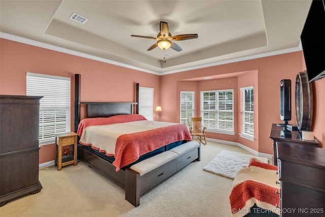 2501 Forest Ridge Parkway, Claremore, OK 74017 - bedroom with a tray ceiling, carpet floors, baseboards, ceiling fan, and crown molding