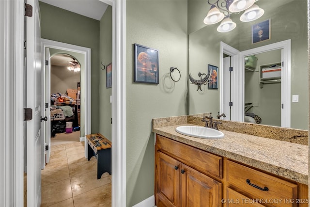 2501 Forest Ridge Parkway, Claremore, OK 74017 - bathroom featuring tile patterned floors, a chandelier, vanity, and ensuite bathroom