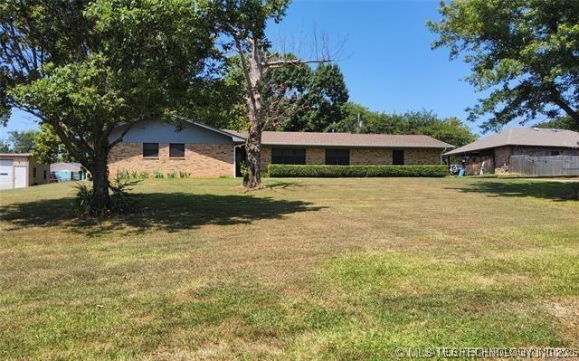 1607 Kay, Durant, OK 74701 - exterior space featuring a yard