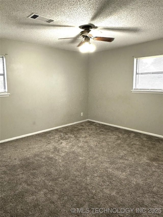 1607 Kay, Durant, OK 74701 - carpeted spare room featuring ceiling fan, healthy amount of natural light, a textured ceiling, and baseboards
