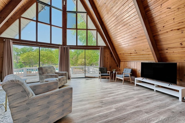 7626 Whispering Way, Kingston, OK 73439 - living room featuring wood walls, wood ceiling, beamed ceiling, and high vaulted ceiling