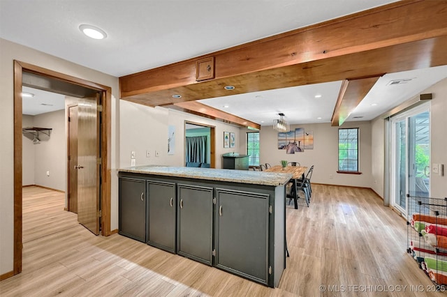 7626 Whispering Way, Kingston, OK 73439 - kitchen with a peninsula, light wood-style flooring, and baseboards