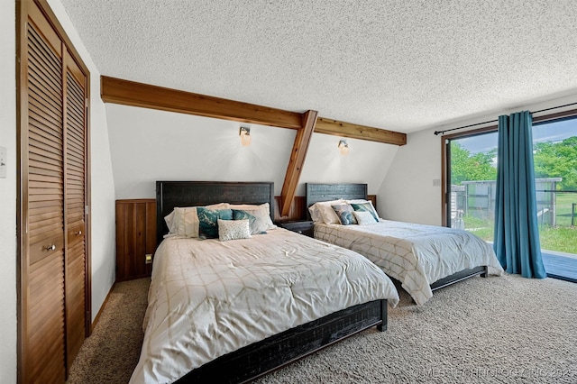 7626 Whispering Way, Kingston, OK 73439 - carpeted bedroom with a textured ceiling, access to outside, and vaulted ceiling with beams