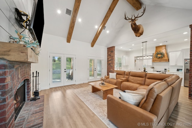 living room featuring high vaulted ceiling, light wood-type flooring, visible vents, recessed lighting, and beamed ceiling