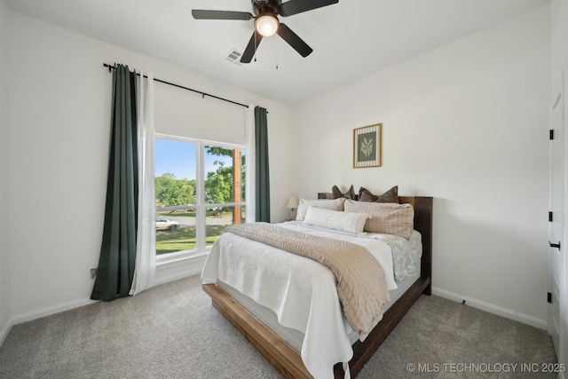 bedroom with ceiling fan, carpet, baseboards, and visible vents